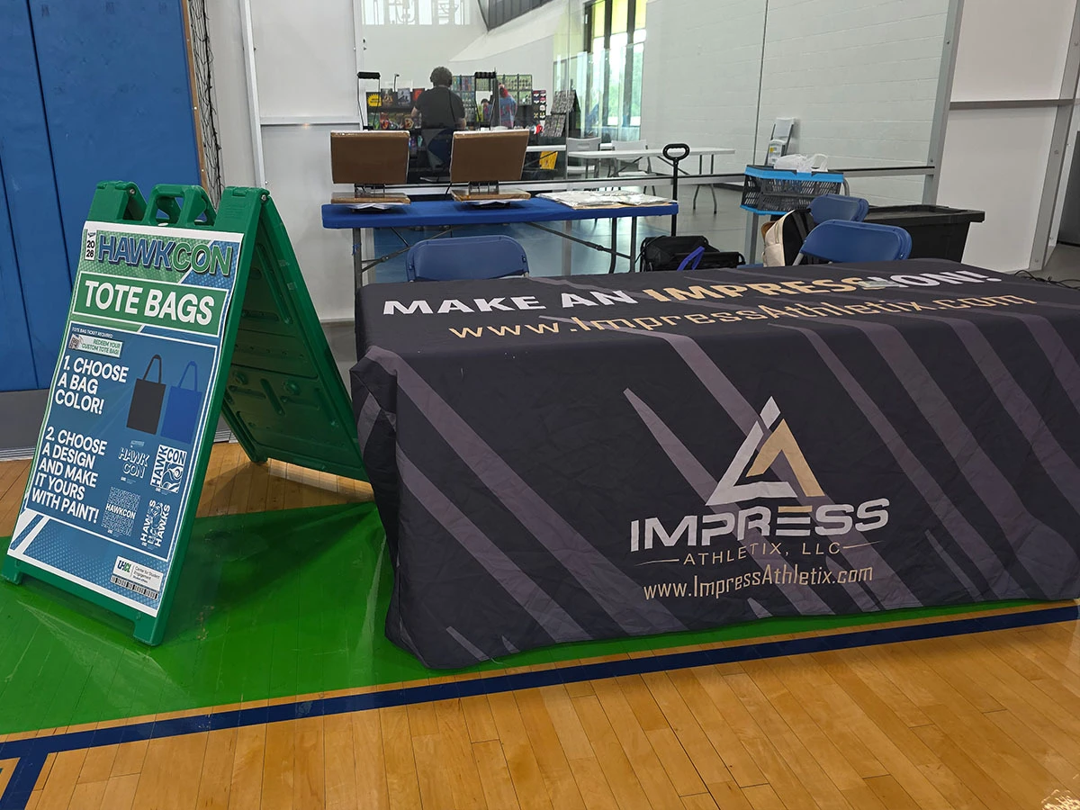 Impress Athletix indoor on-site event merchandise setup