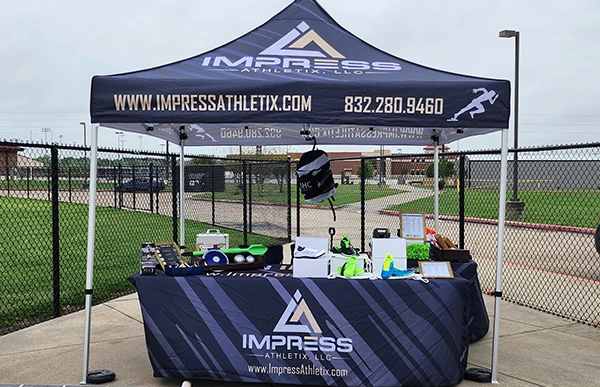 Impress Athletix booth at Top Flight Track Meet