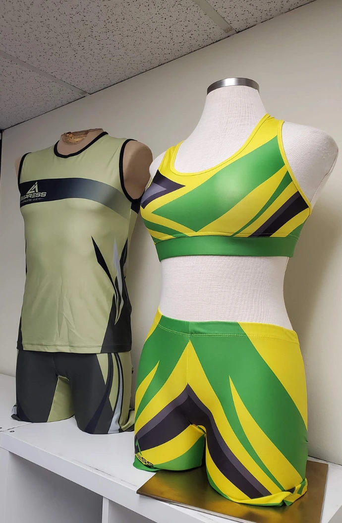Custom track and field uniforms displayed on mannequins by Impress Athletix