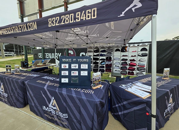 Impress Athletix on-site event merchandise booth with apparel displays and custom merchandise setup