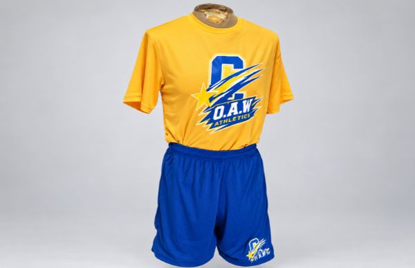 Polished gold and blue team uniform by Impress Athletix