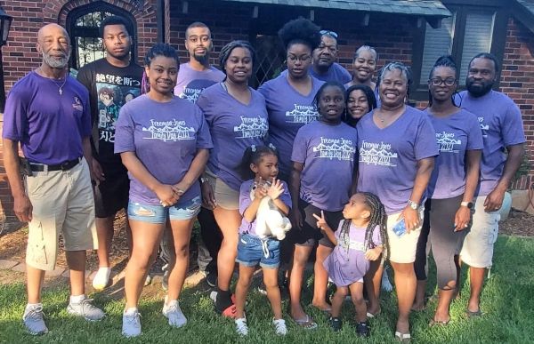 Family reunion group wearing matching t-shirts.