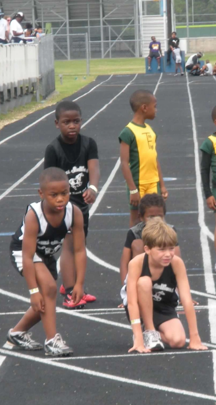Youth track athletes at a track meet.